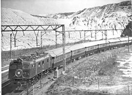 Johannesburg, 1957. SAR Class 3E with Blue Train near Driehoek.