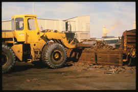 Richards Bay, September 1984. Loading scrap iron with forklift from train wagon. [T Robberts]