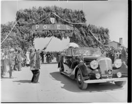 Port Elizabeth, 27 February 1947. Royal family in open Daimler given a traditional greeting as th...