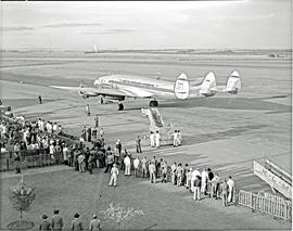 Johannesburg, 1950. Palmietfontein airport. Passengers boarding SAA Lockheed Constellation ZS-DBR...
