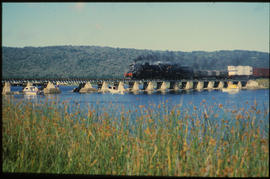 Knysna, February 1987. Mixed train on bridge over Knysna lagoon. [T Robberts]