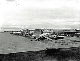 Johannesburg, 1962. Jan Smuts airport. Various aircraft lined up in front of buildings.