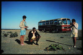 Namib Desert, South-West Africa, 1972. SAR Mercedes Benz tour bus at Welwitchia plant.
