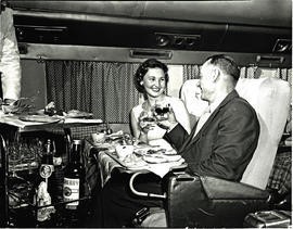 
SAA Douglas DC-7B interior, dinner being served.
