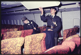 SAR police checking interior of Boeing aircraft.