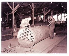 Springs, 1940. Steel cutting machine at engineering works.