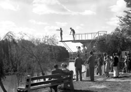 Parys, 1939. High diving board on river bank with crowd watching.