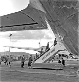 Windhoek, Namibia, 1963. JG Strijdom airport. Douglas DC-4. Aircraft stairs with covered wheels.