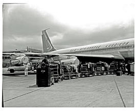 
SAA Boeing 707, luggage being towed away.
