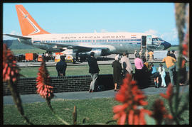 Durban, July 1970. Louis Botha Airport. Arrival of passengers for the Durban July horse race with...