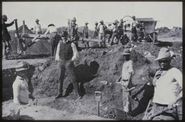 Workers at excavations, possibly panning for alluvial diamonds.