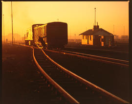 Johannesburg, 1990. Sunset over diesel locomotive.