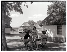 Kruger National Park, 1961. Relaxing at Satara rest camp with SAR Chevrolet motor coach No MT6918...