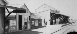 Fraserburg, 1895. Station building with men posing on platform. (EH Short)