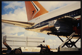 Luggage containers being loaded into Boeing 747 ZS-SAN 'Lebombo'.