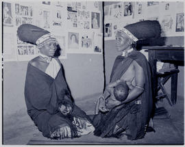 
Two Zulu women, one suckling baby.
