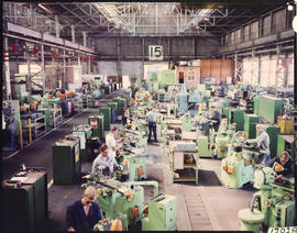 Fitters and turners in large workshop.