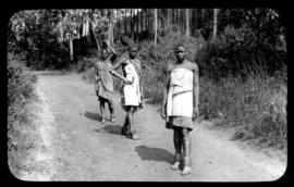 Round in Nine Tours - three black women in rural road.