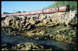 Cape Town, January 1987. SAR type 5M2A suburban train near Kalk Bay. [T Robberts]
