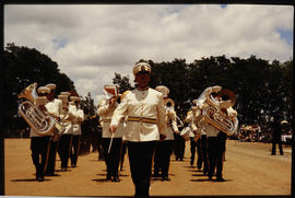 Uniformed brass band on the march.