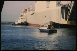 Richards Bay, January 1983. Tug and police launch in Richards Bay Harbour. [T Robberts]
