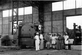 Madagascar, 1947. Unidentified group in large industrial building.