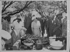 Orange Free State Game Reserve, 8 March 1947. Queen Elizabeth inspects traditional foods.