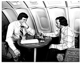 
SAA Boeing 747 interior. Two men playing chess.
