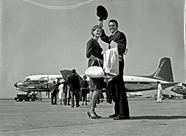 
Passengers waving before embarkation. Douglas DC-7B ZS-DKG.
