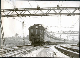 Johannesburg, 1939. Electric train alongside mine dump.