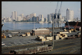Durban, January 1983. Railway lines and goods on wharf in Durban Harbour. [T Robberts]