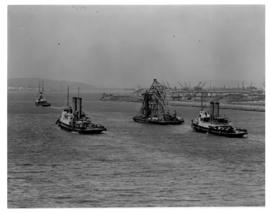 Durban, circa 1901. Three tugs and floating crane entering Durban Harhour.  (Durban Harbour album...