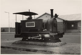 Walvis Bay, South-West Africa, 1968. Old locomotive plinthed at railway station.
