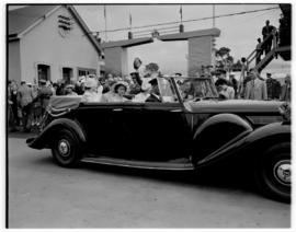 
Royal family leaving in open Daimler.

