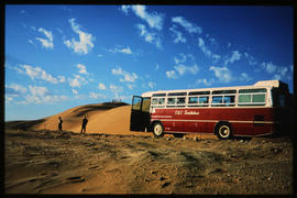 Swakopmund district , South-West Africa, 1976. SAR Mercedes Benz tour bus at sand dune.