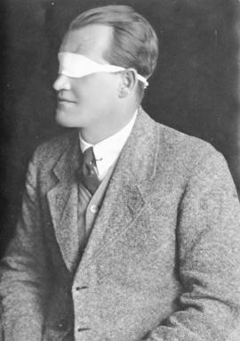 Mr W Bruen, vision-impaired with blindfold.