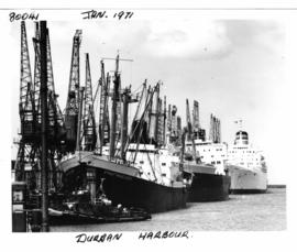 Durban, January 1971. Ships lined up alongside cranes in Durban Harbour.