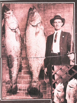Proud angler with two large fishes.
