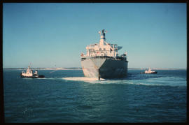 Saldanha, August 1977. SAR tug with ore carrier in Saldanha Bay Harbour. [CJ Dannhauser]