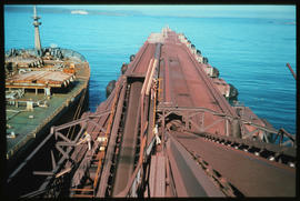 Saldanha, 1977. Ore carrier docked alongside iron ore loading facility at Saldanha Bay Harbour. [...