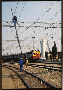 
Working on the catenaries at railway station.
