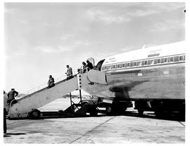 Johannesburg, 1970. Jan Smuts airport. SAA Boeing 707 ZS-SAG 'Durban'. Passengers walking down fr...