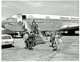 Johannesburg, 1970. Jan Smuts airport. SAA Boeing 707 ZS-SAG 'Durban'. Passengers on stairs. Note...