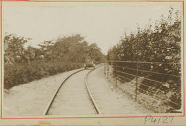 Motorised trolley on railway curve.