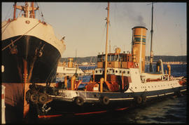 Durban, 1967. SAR tug 'Sir William Hoy' assisting ship in Durban Harbour.
