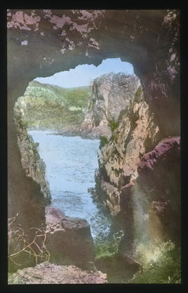 Knysna. A cove viewed through rock opening.