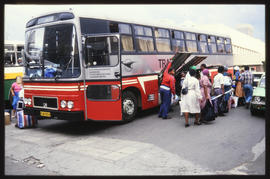 Passengers boarding SAR Transtate passenger bus. Note the MAN-Bussing (Büssing) lion emblem on th...