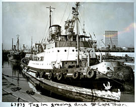 "Cape Town, 1957. Harbour tug 'FT Bates' in Victoria graving dock in Table Bay harbour."