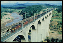 Ulundi district, 1986. Train crossing the bridge over the White Mfolozi River on the Richards Bay...