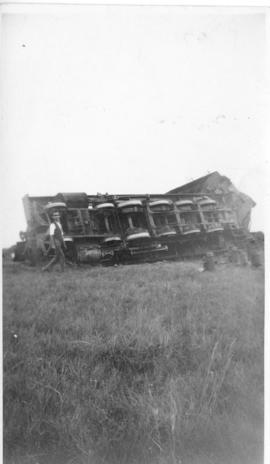 Derailed locomotive on its side. (Lund collection)